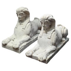 Pair of carved Carrara marble sphinxes