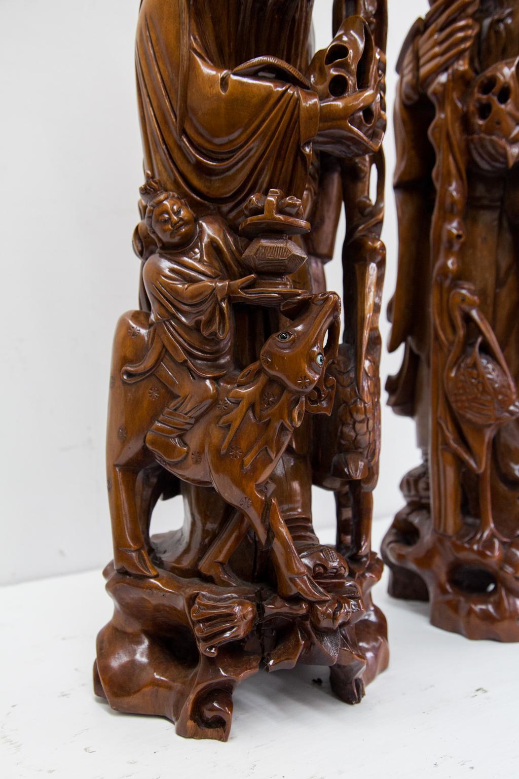 Hand-Carved Pair of Carved Chinese Figural Lamps