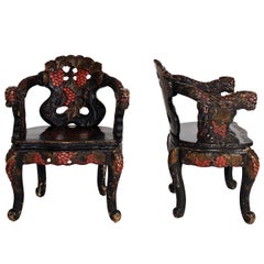 Pair of Carved Ebonized East Asian Chairs