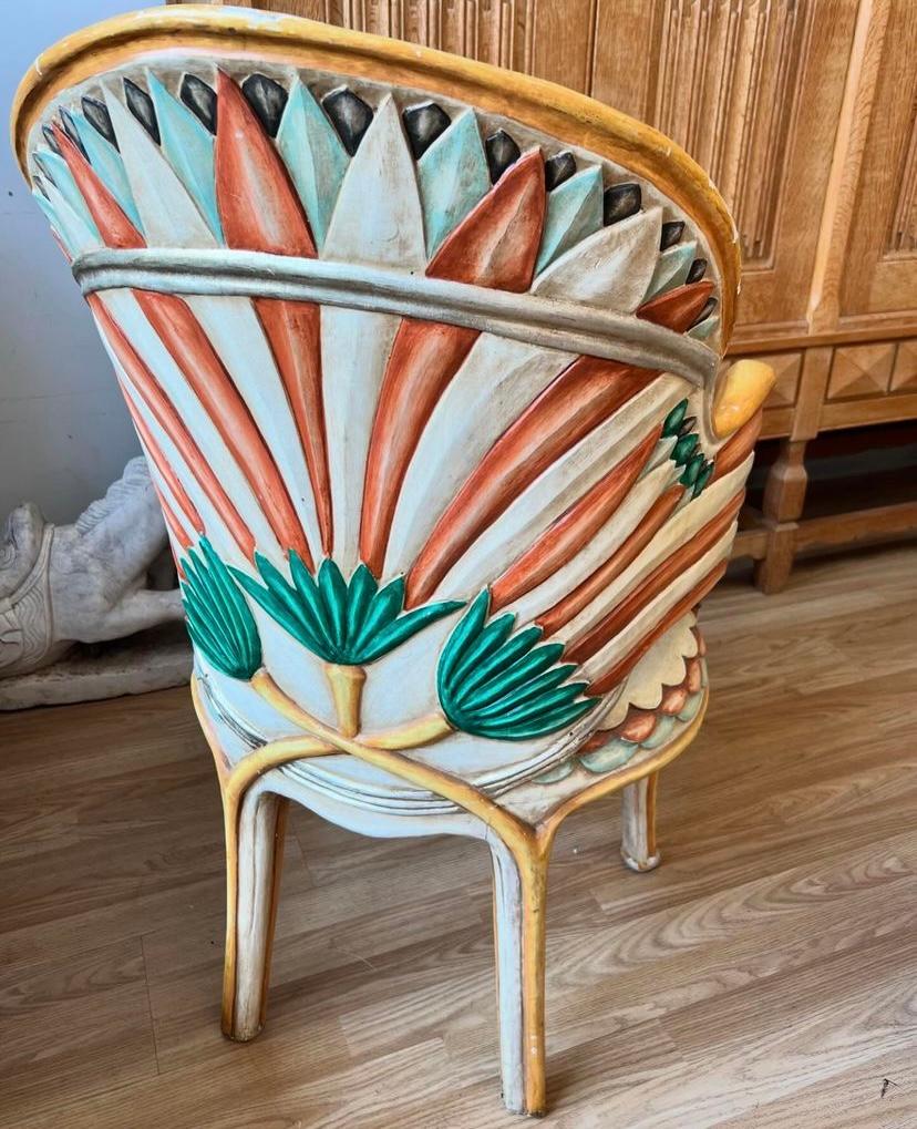 Unique art deco Egyptian revival armchairs designed by Bartolozzi e Maioli. Made in Italy, these chairs are beautifully hand-carved and painted with stylized lotus leaves, and fish scales along the edge of seating, circa 1950s. Stunning statement