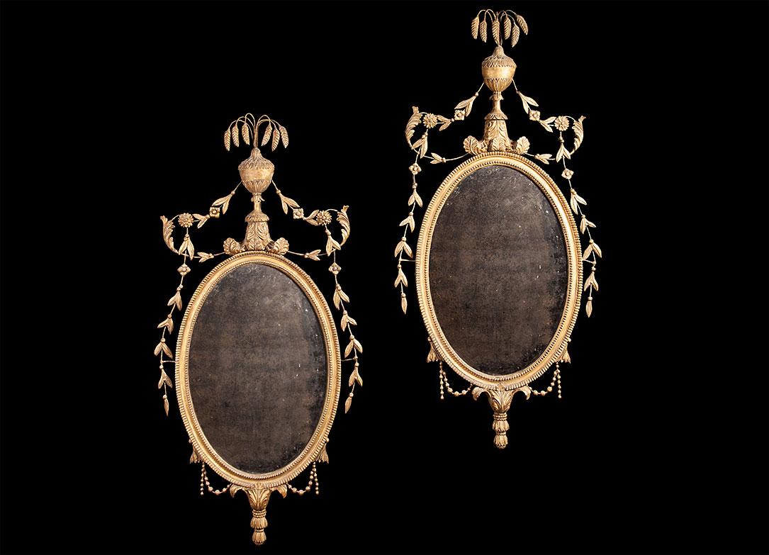 Pair of Carved Giltwood Neoclassical Oval Mirrors In Good Condition For Sale In Tyrone, Northern Ireland