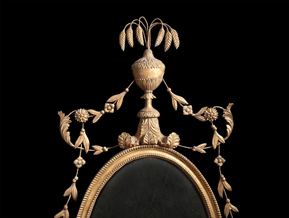 18th Century Pair of Carved Giltwood Neoclassical Oval Mirrors For Sale