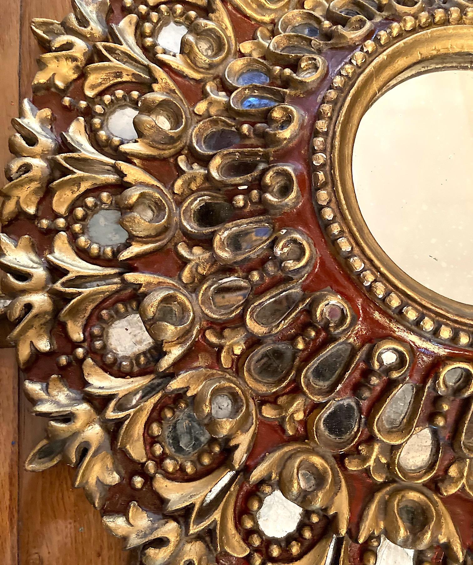 Hand-Carved Pair of Carved Giltwood Sunburst Mirrors. Sold individually For Sale