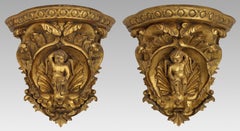Pair of Carved Giltwood Wall Brackets with Cherub Motifs
