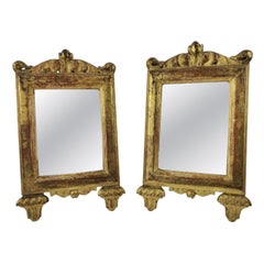 Coppia di specchi da parete in legno intagliato e dorato, 1780 circa