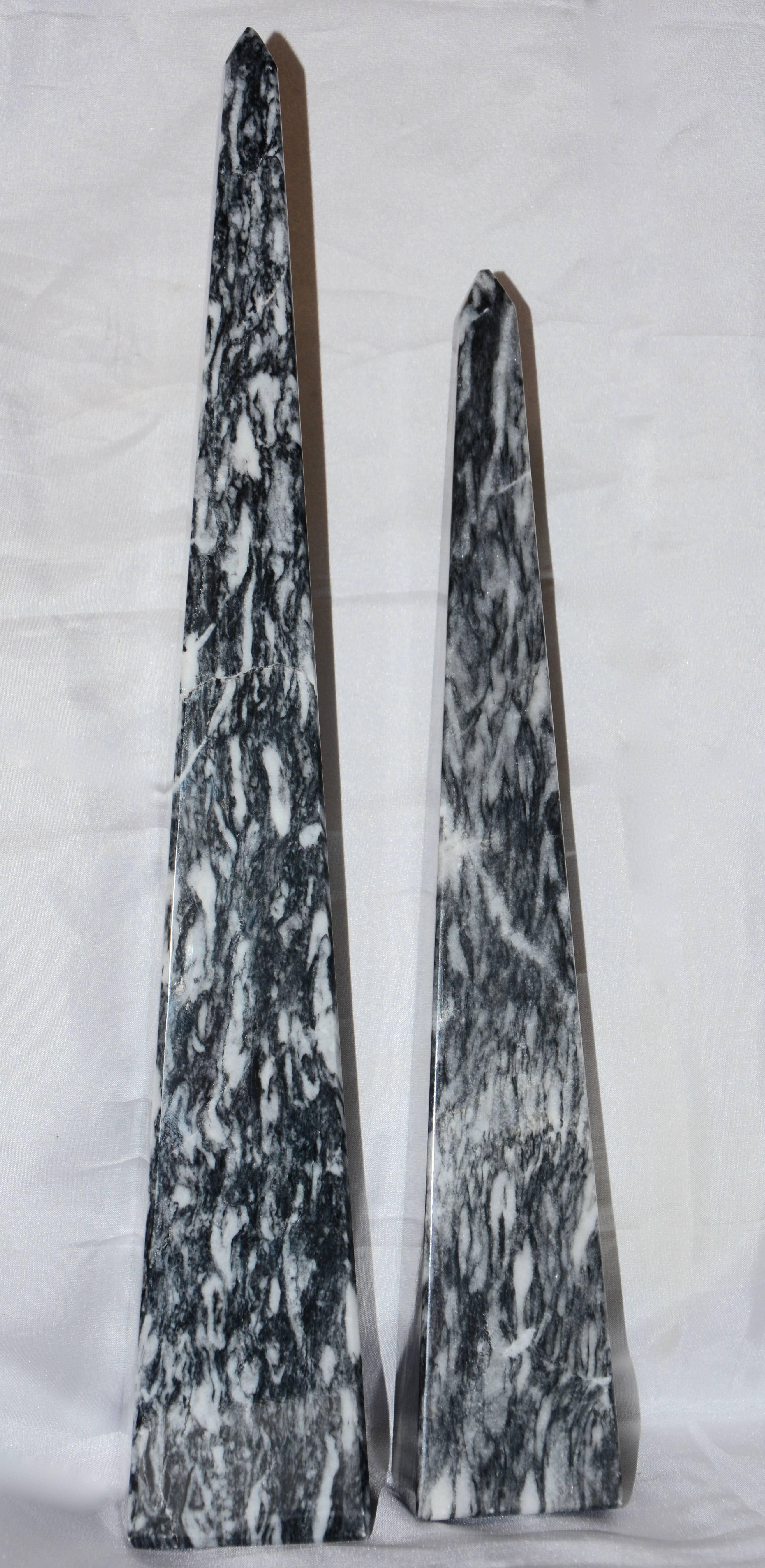 Striations of gray and white accent this pair of marble obelisks. Smooth lines are dotted with natural cracks and veining.
Measurement in the listing is for the tallest piece.
Smaller piece measures 2.19 inches x 2.19 inches x 13.25 inches tall.