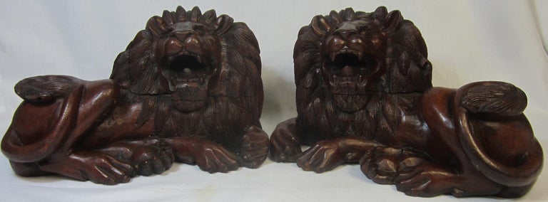 Pair of Carved Hard Wood African Lions For Sale at 1stDibs