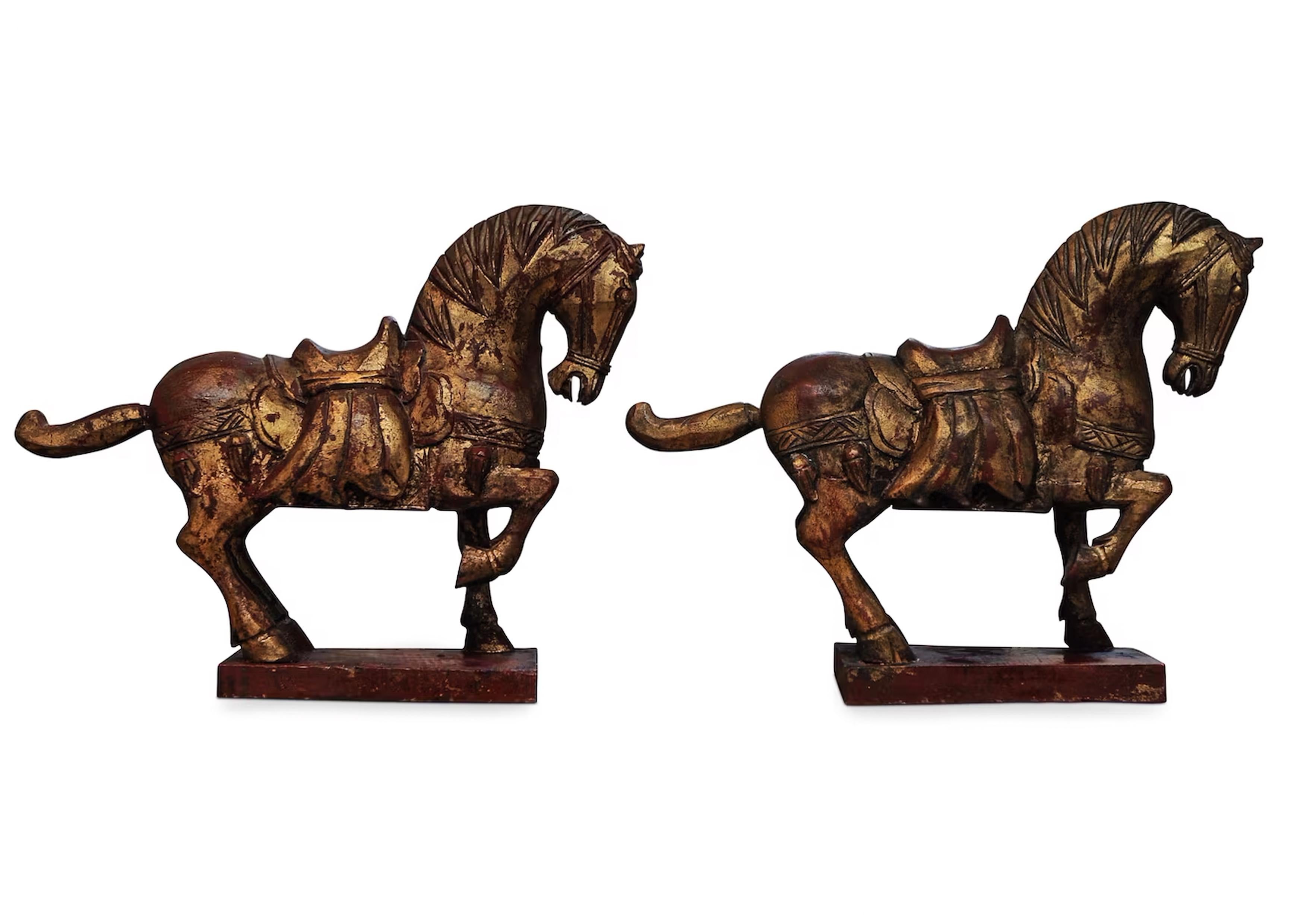 A Vibrant Pair of Tang Dynasty Style Hand Painted & Hand Carved Chinese Horses - priced as a pair 

Decorative wooden horses that would suitably adorn a shelf, a large desk, or plinth. 

Dimensions of each horse 
Height 25cm
Width 33cm 
Depth of