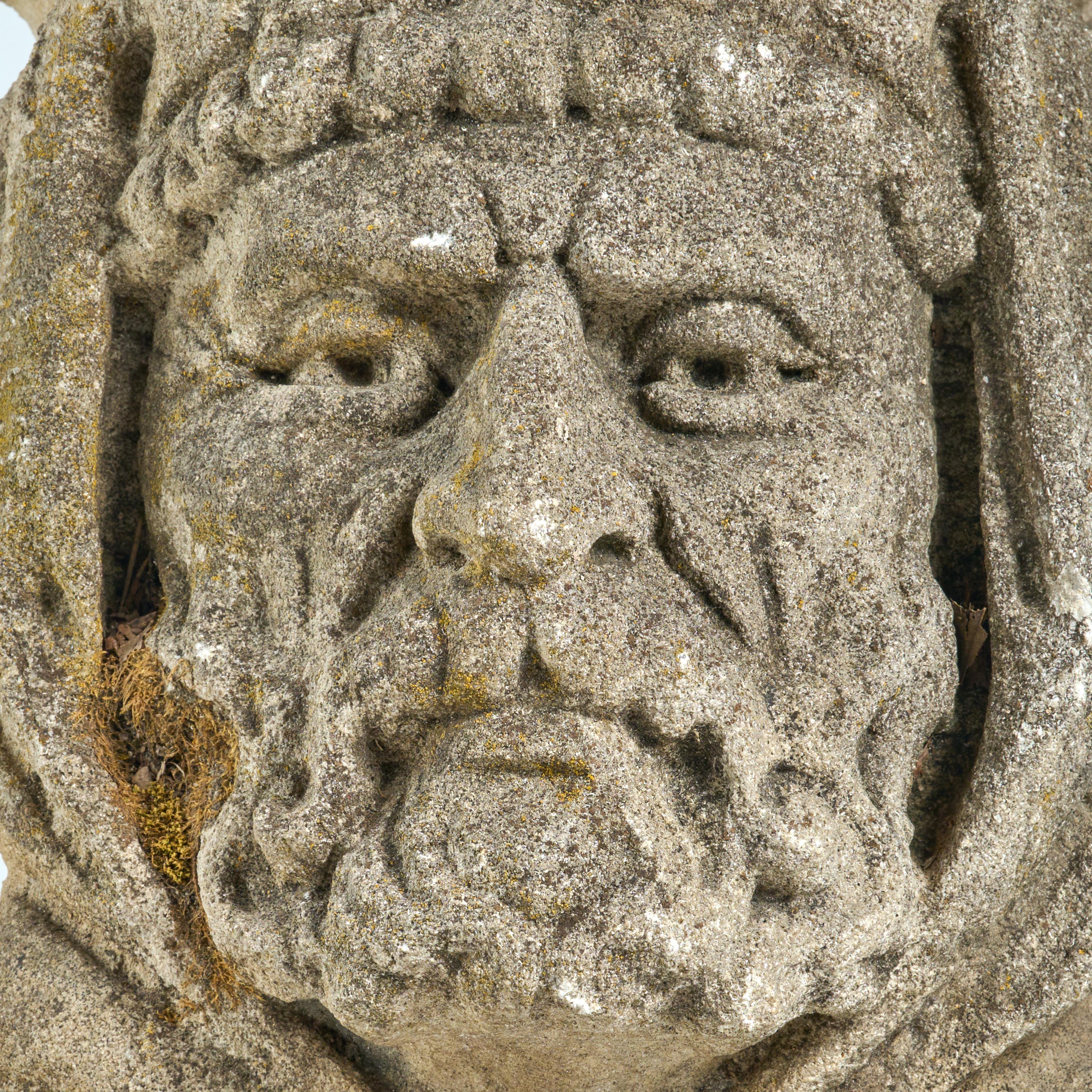 Metal Pair of Carved Limestone Heads from a Building Facade For Sale