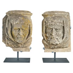 Pair of Carved Limestone Heads from a Building Facade