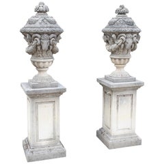 Pair of Carved Limestone Ram Heads Vases on Pedestals