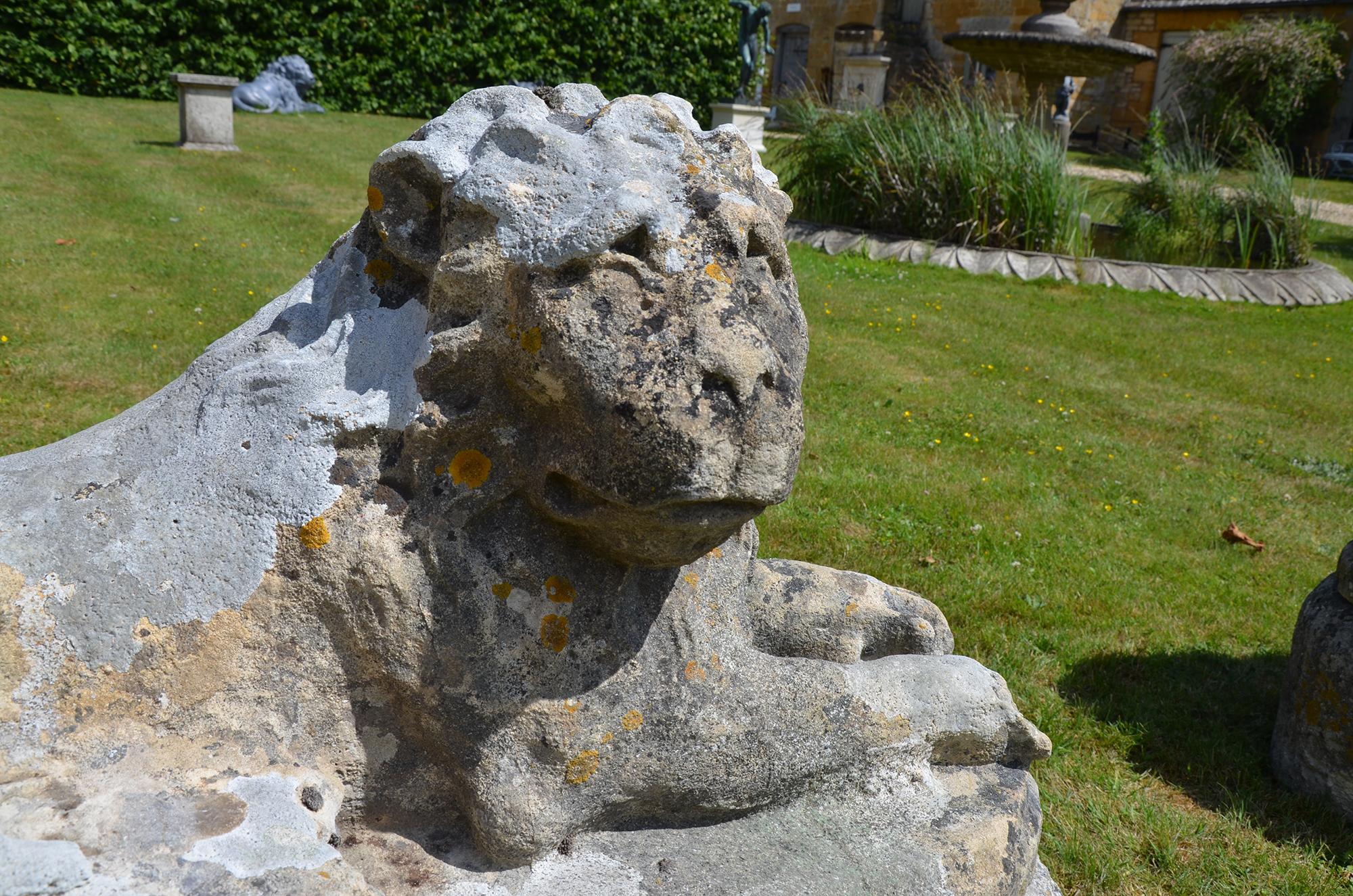 Pair of Carved Limestone Recumbent Lions In Good Condition For Sale In Cheltenham, Gloucestershire