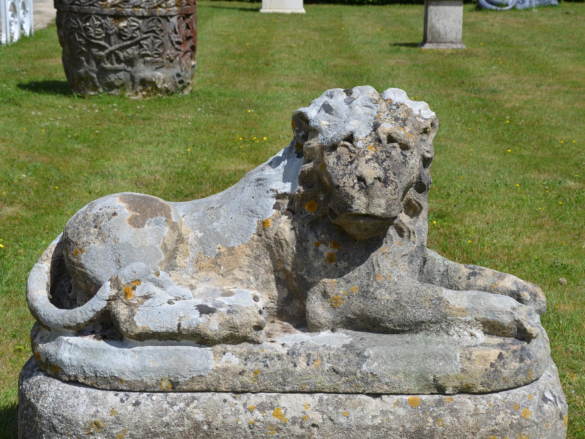 Hand-Carved Pair of Carved Limestone Recumbent Lions For Sale