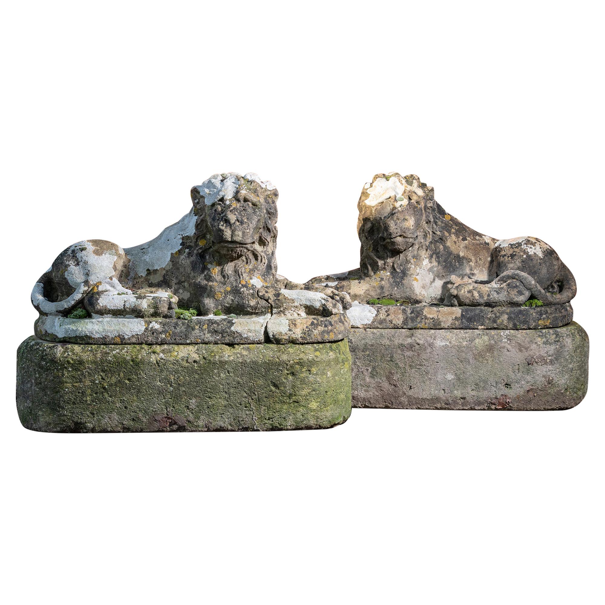 Pair of Carved Limestone Recumbent Lions For Sale