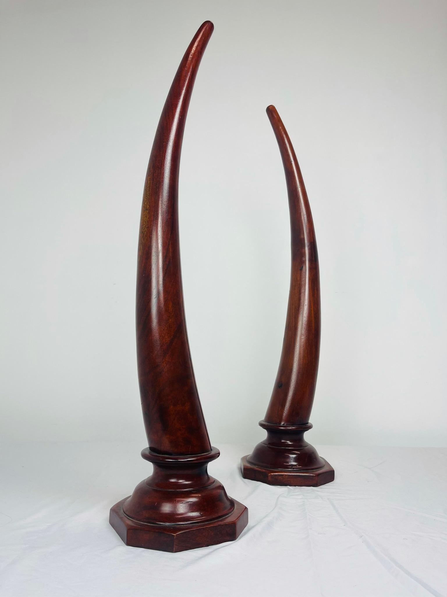 Pair of Carved Mahogany Tusks 1