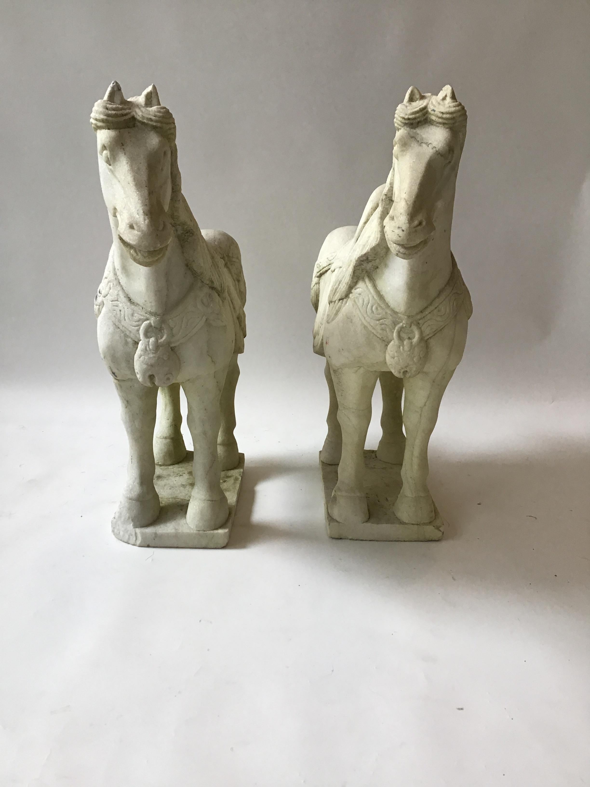 Pair of beautiful 1960s carved marble Asian horses. From a Southampton, NY estate where they guarded the front door.