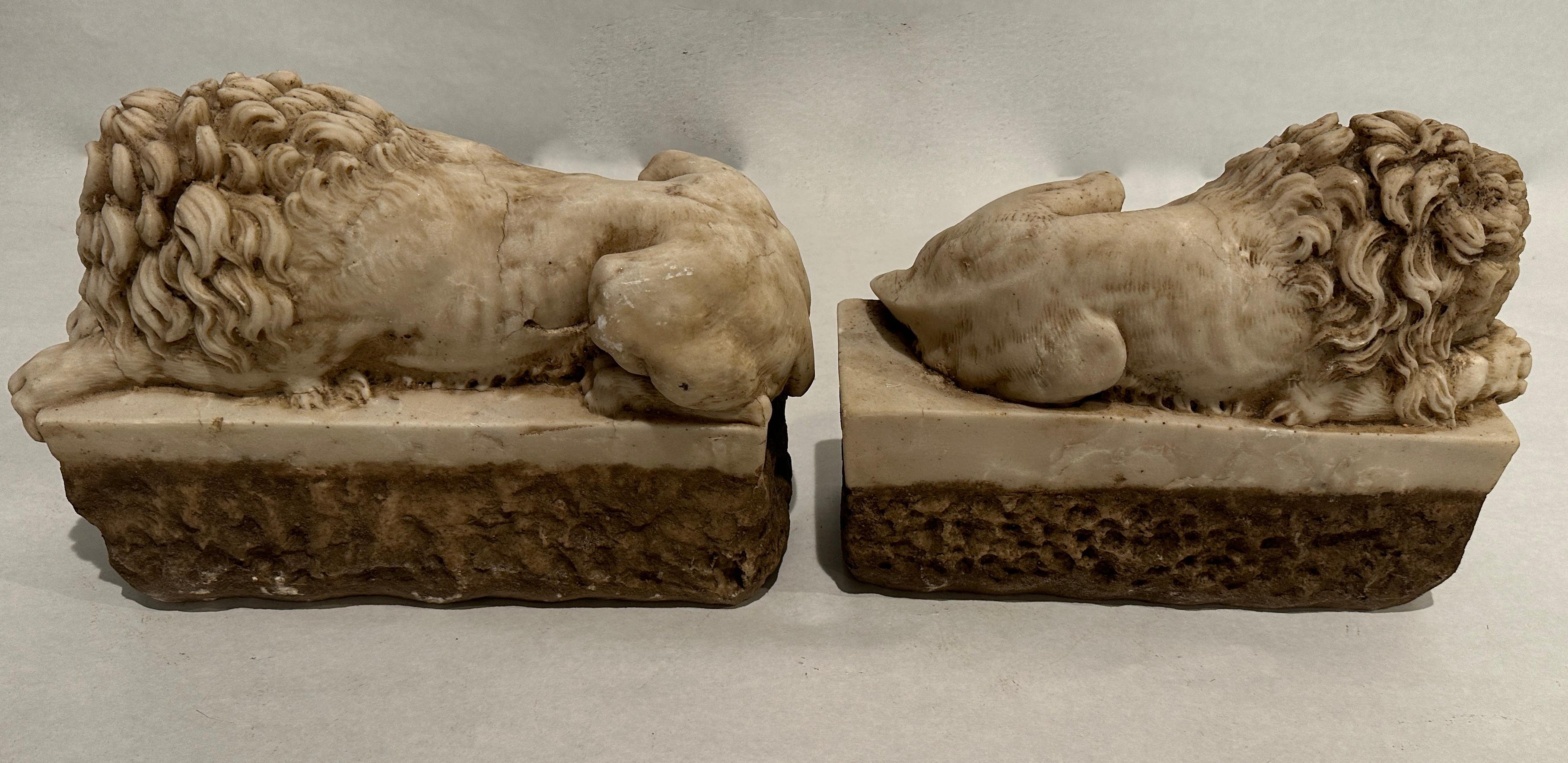 Pair of Carved Marble Recumbent Lions For Sale at 1stDibs