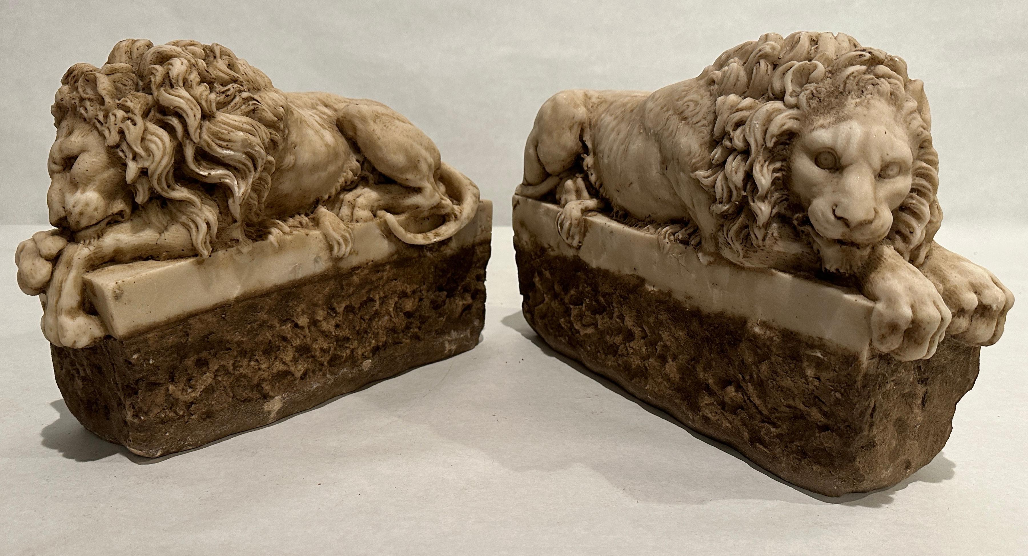 Pair of Carved Marble Recumbent Lions For Sale at 1stDibs