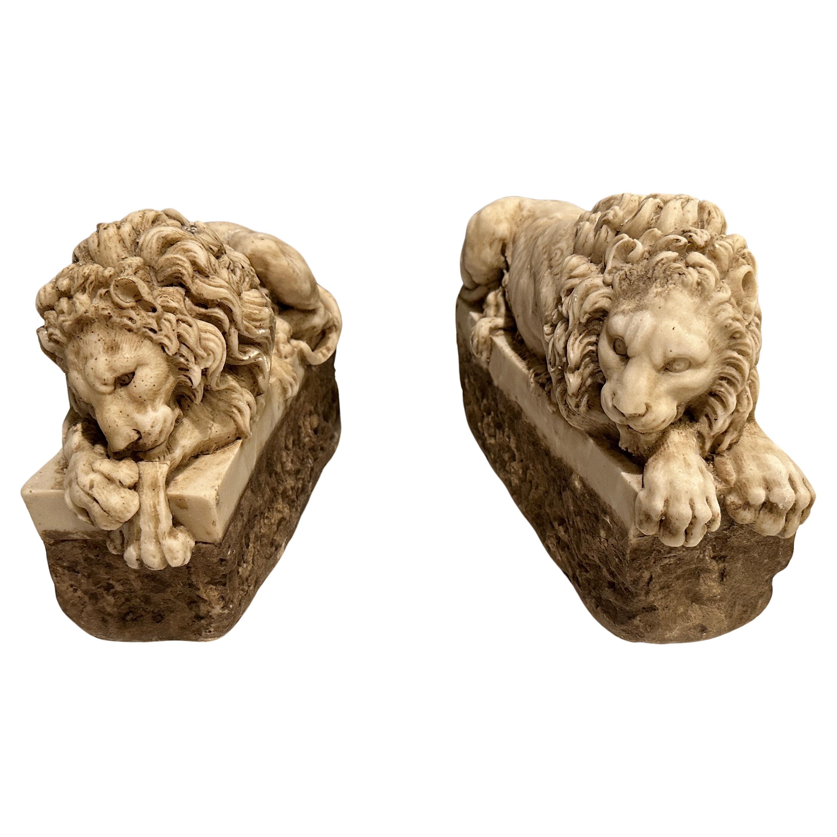 Pair of Carved Marble Recumbent Lions For Sale