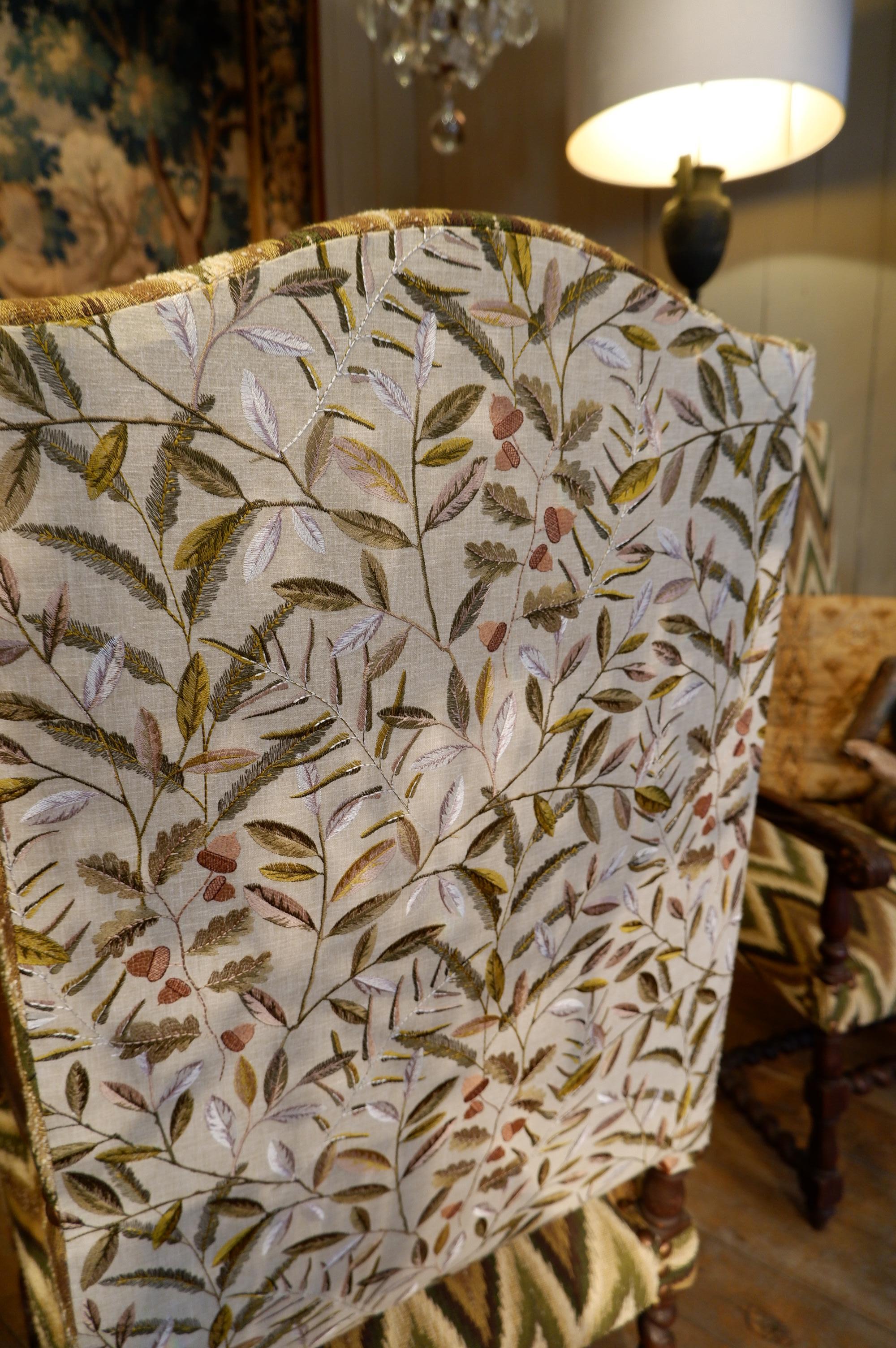 19th Century Pair of carved oak armchairs with scrolls and flamed fabric For Sale