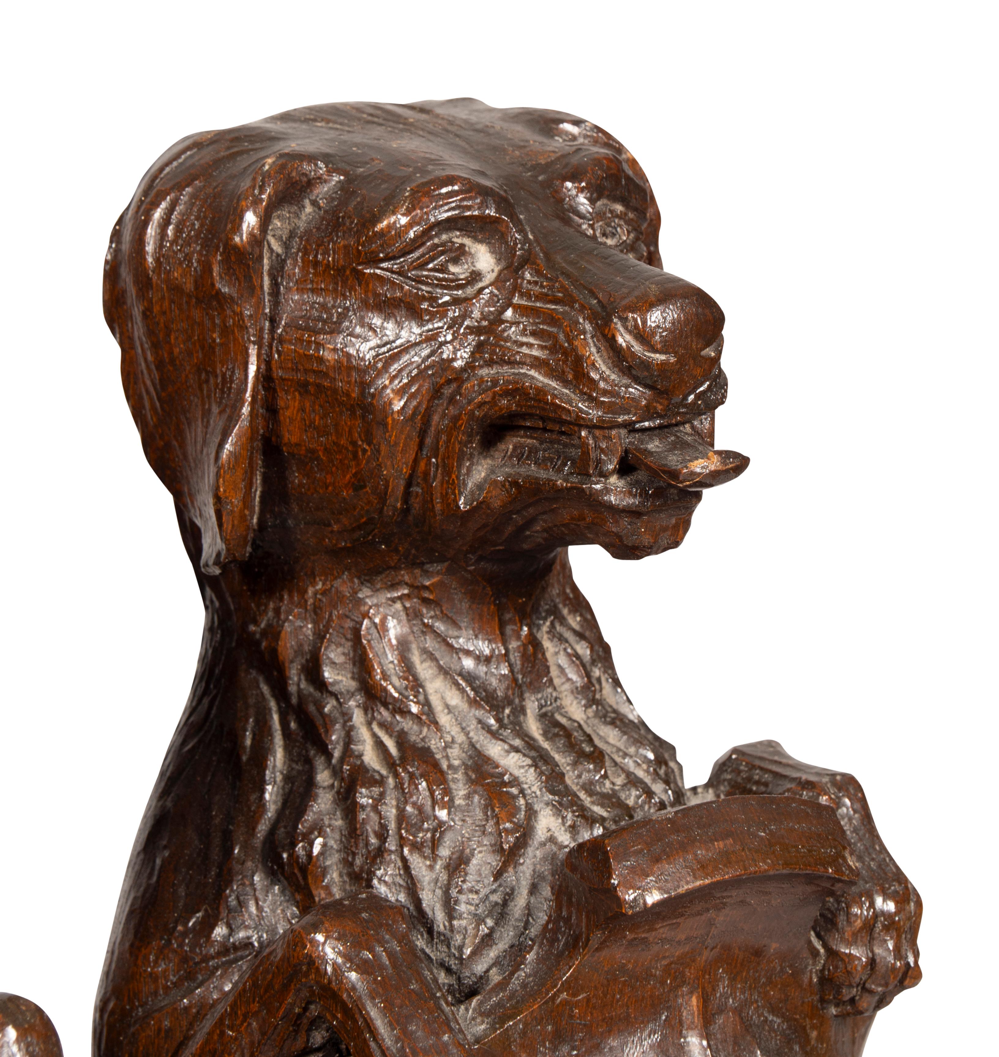 Pair Of Carved Oak Figures Of Seated Dogs With Shields For Sale 7
