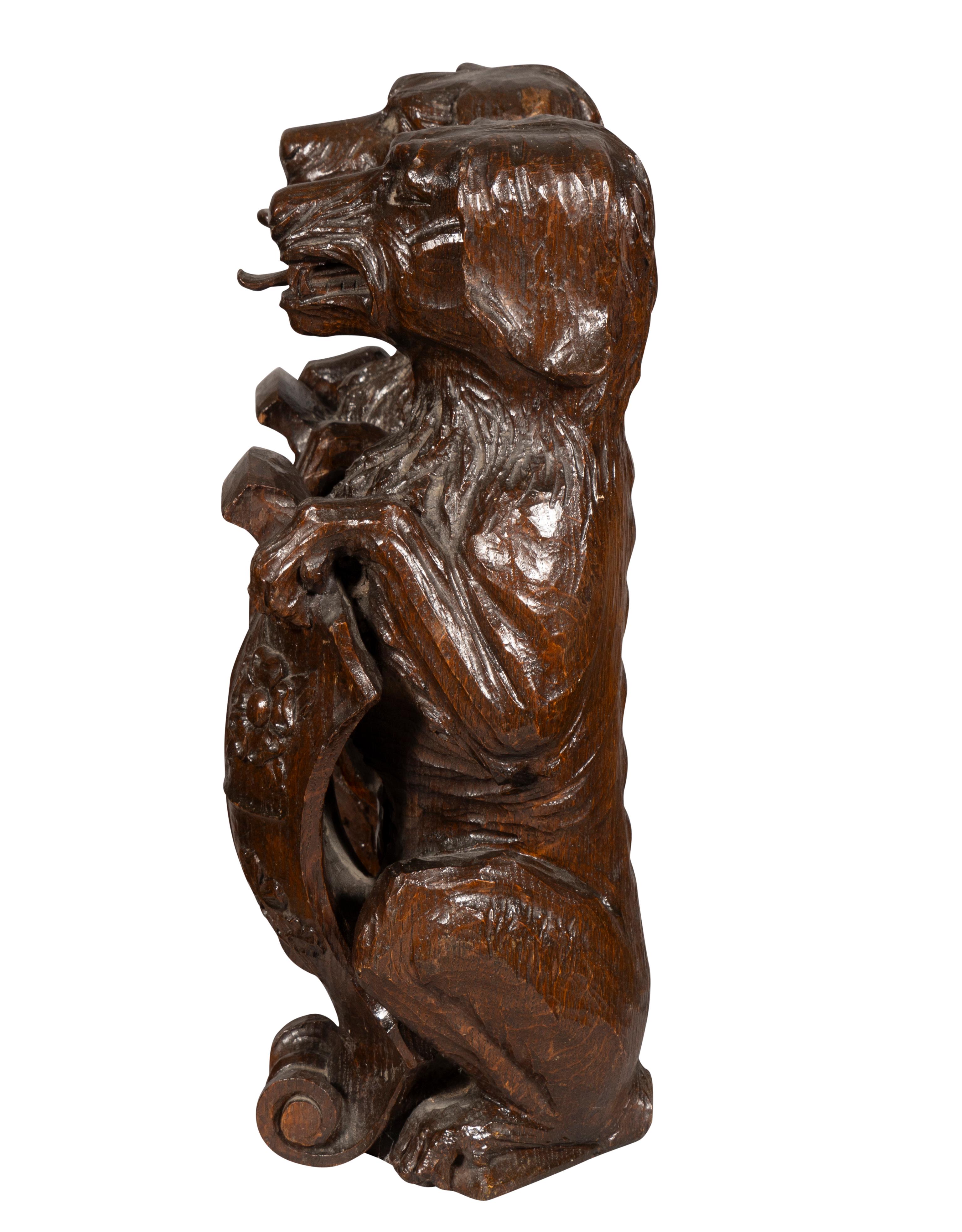 Pair Of Carved Oak Figures Of Seated Dogs With Shields In Good Condition For Sale In Essex, MA