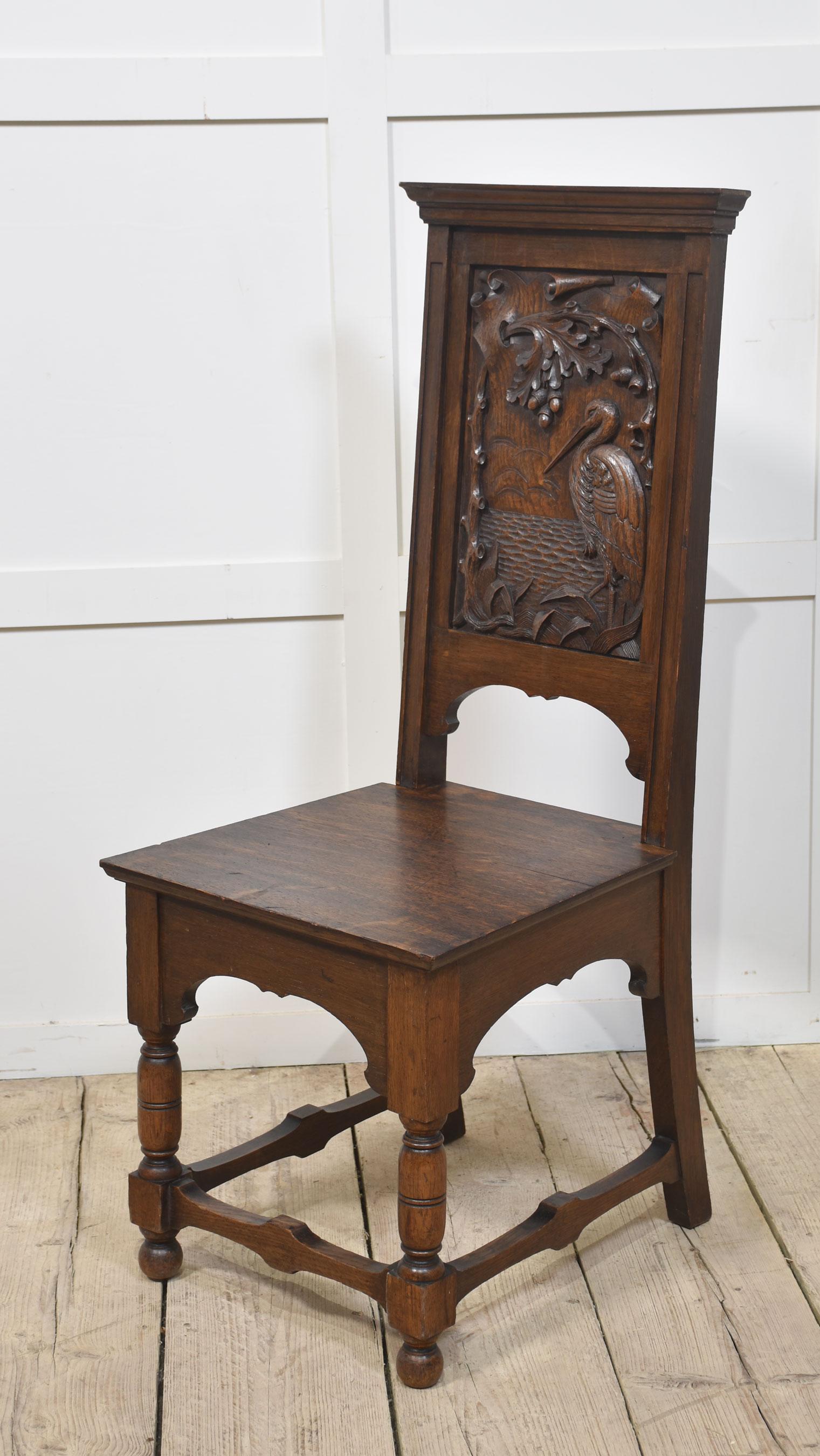 Pair of carved oak hall chairs, each having a panelled back decorated with a stork above the oak seat. Raised up on turned and blocked front legs united by stretchers.
Dimensions
Height 45 Inches height to seat 18.5 Inches
Width 18.5 Inches
Depth