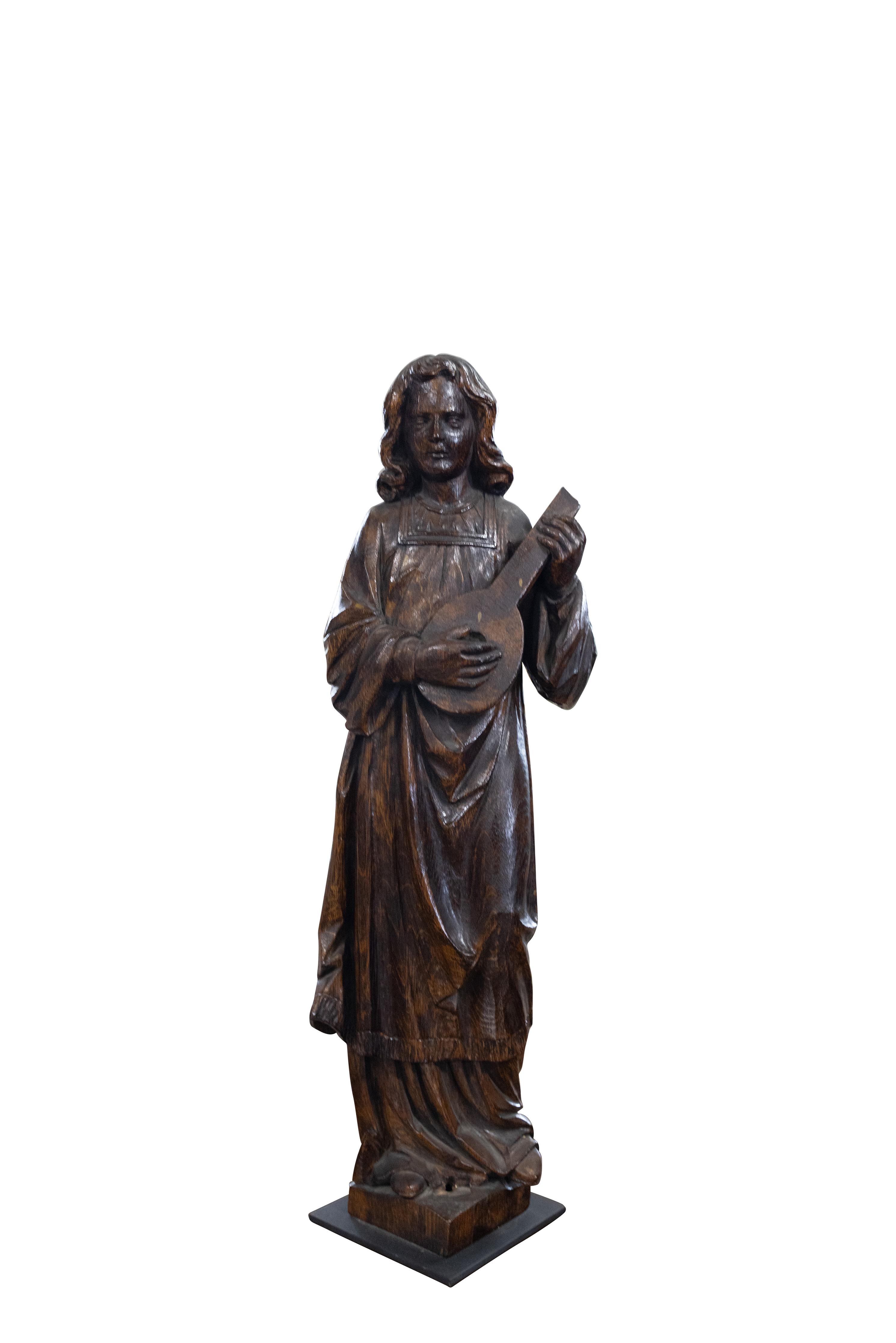 Pair of carved oak musicians with custom metal base. Excellent quality. Circa 1900.

Dimensions: 28