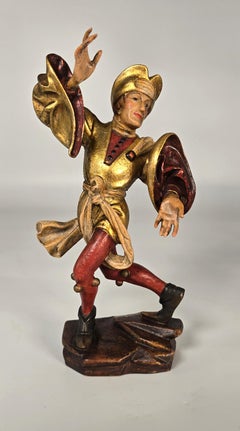 Pair of carved polychrome and gilt painted jester figures, Swiss or German C1930