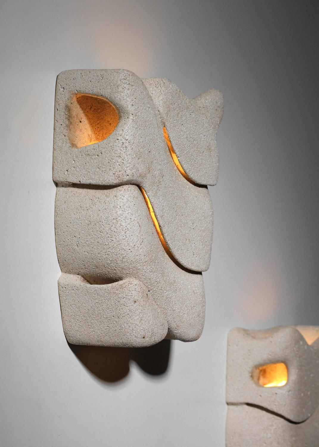 French Pair of carved reconstituted stone wall lights, unsigned For Sale