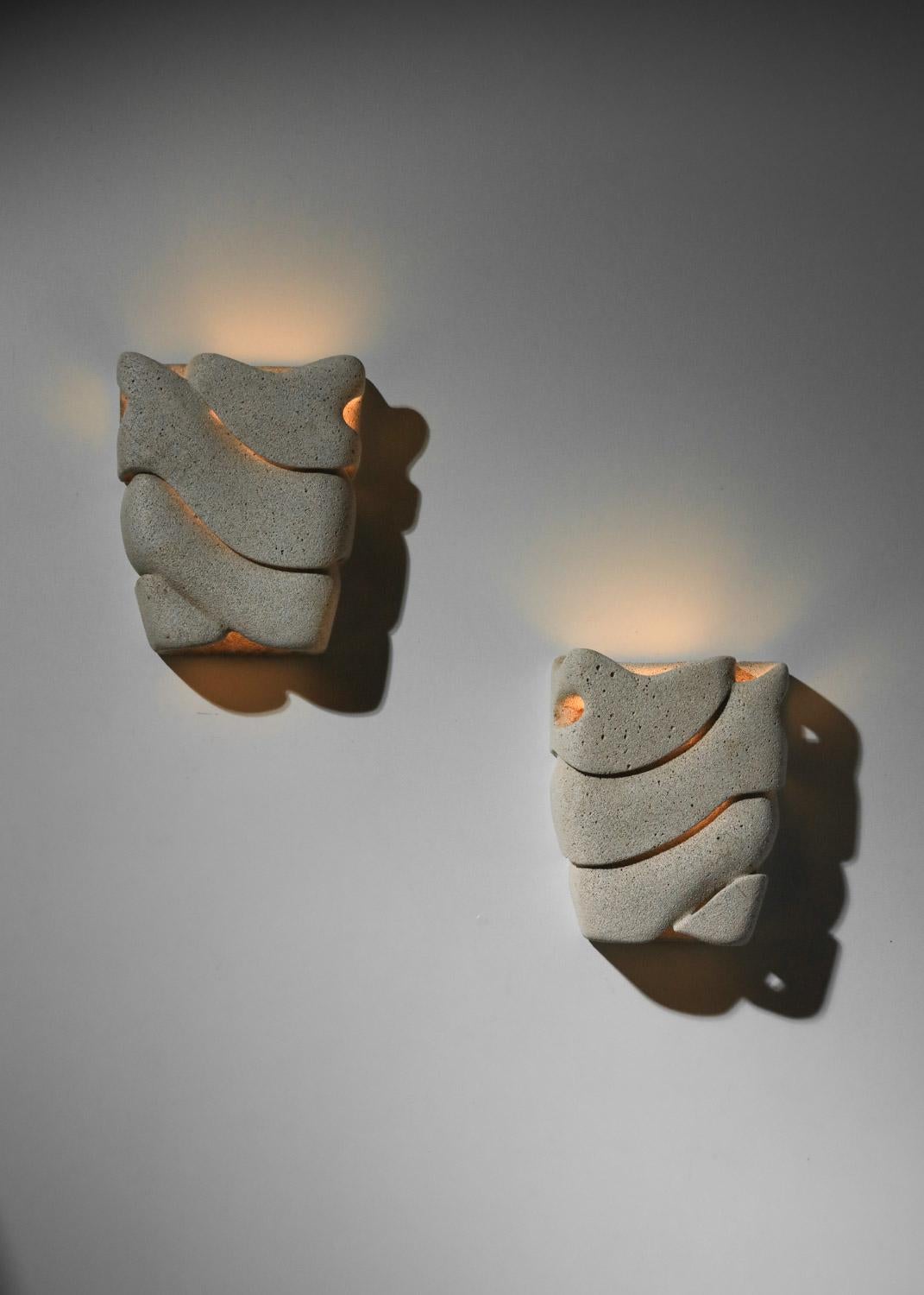 Stone Pair of carved reconstituted stone wall lights, unsigned For Sale