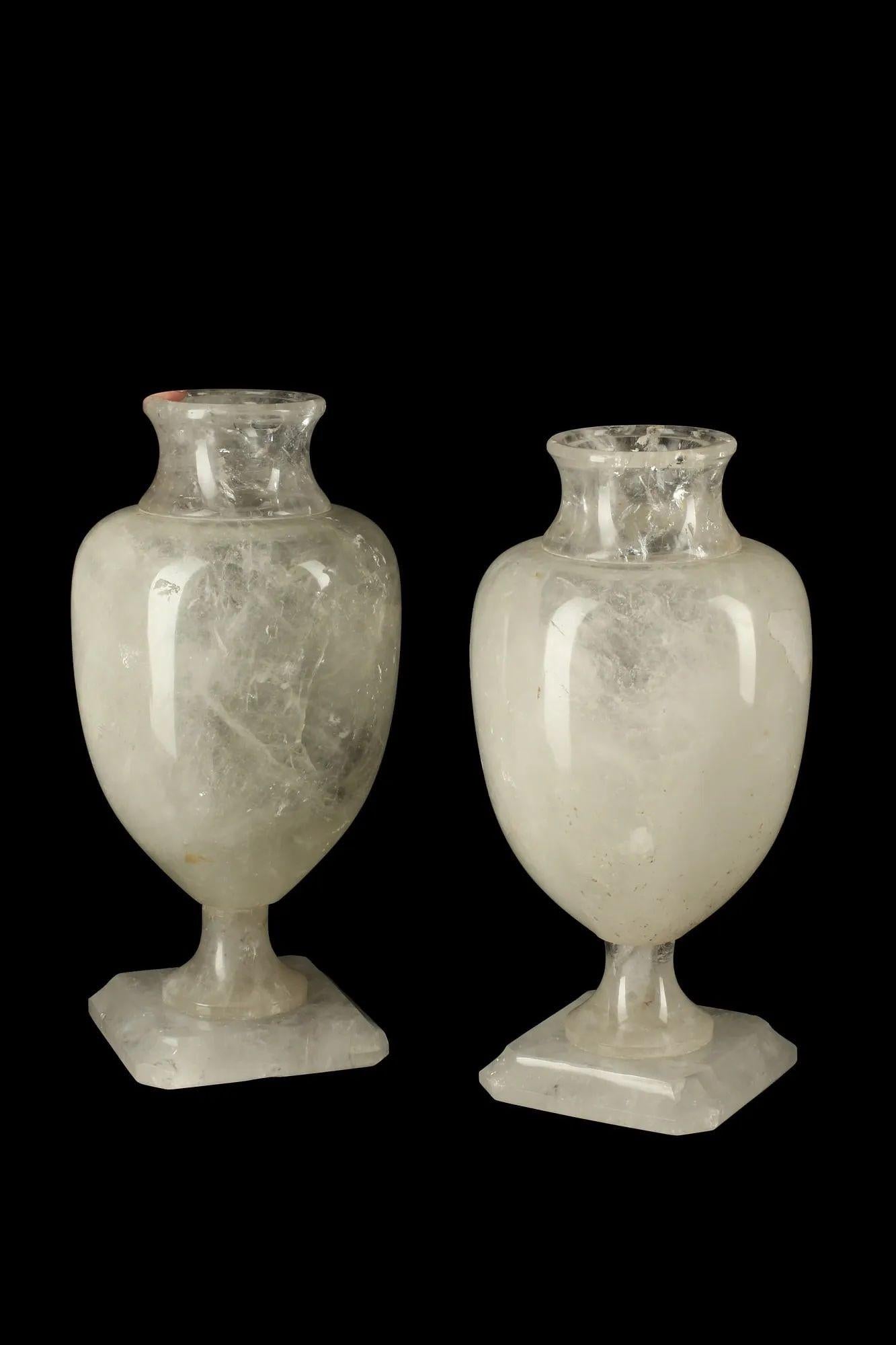 Pair of Neoclassical style rock carved rock crystal urns, made in Italy in the 20th Century.
Dimensions:
14