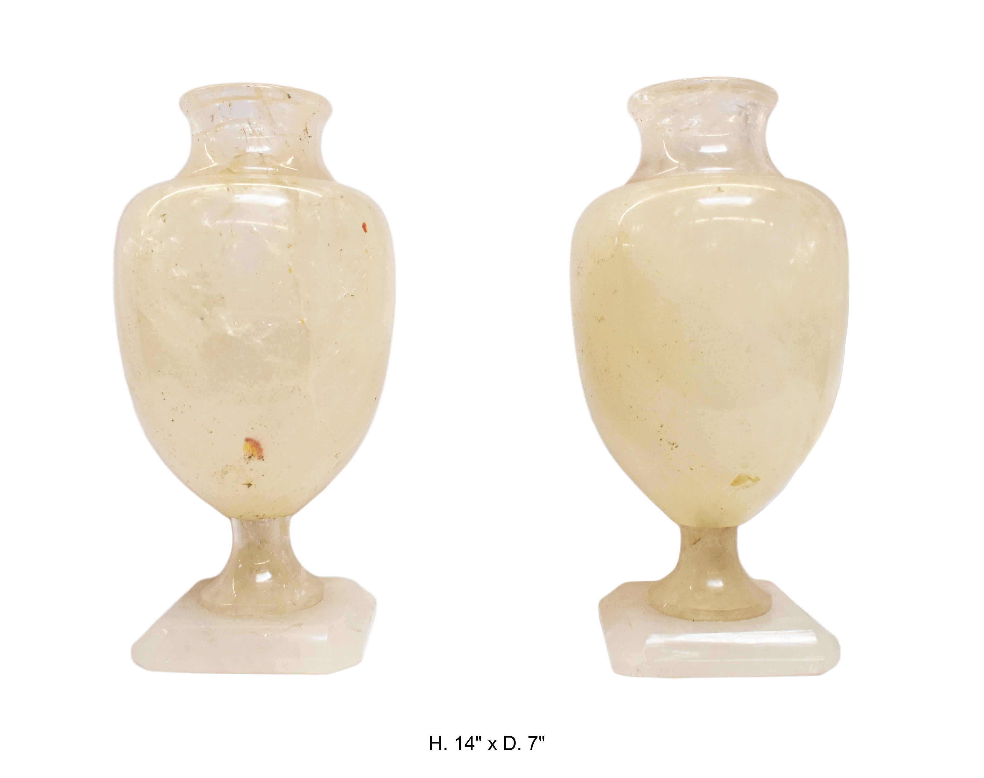 Unique large pair of neoclassical style hand carved and hand-polished rock crystal vases. 
The inside of the vases were masterfully carved out.

Measures: H. 14