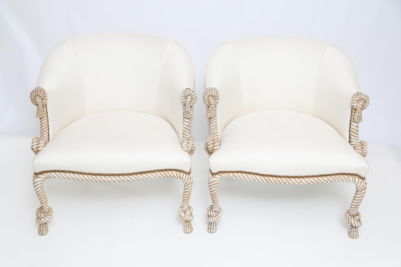 Pair of bergère armchairs, in the manner of AME Fournier (French, active after 1850), having a painted finish showing natural wear, each frame of wood carved to resemble rope, with knots on arms, and above each tassel foot, upholstered rounded back