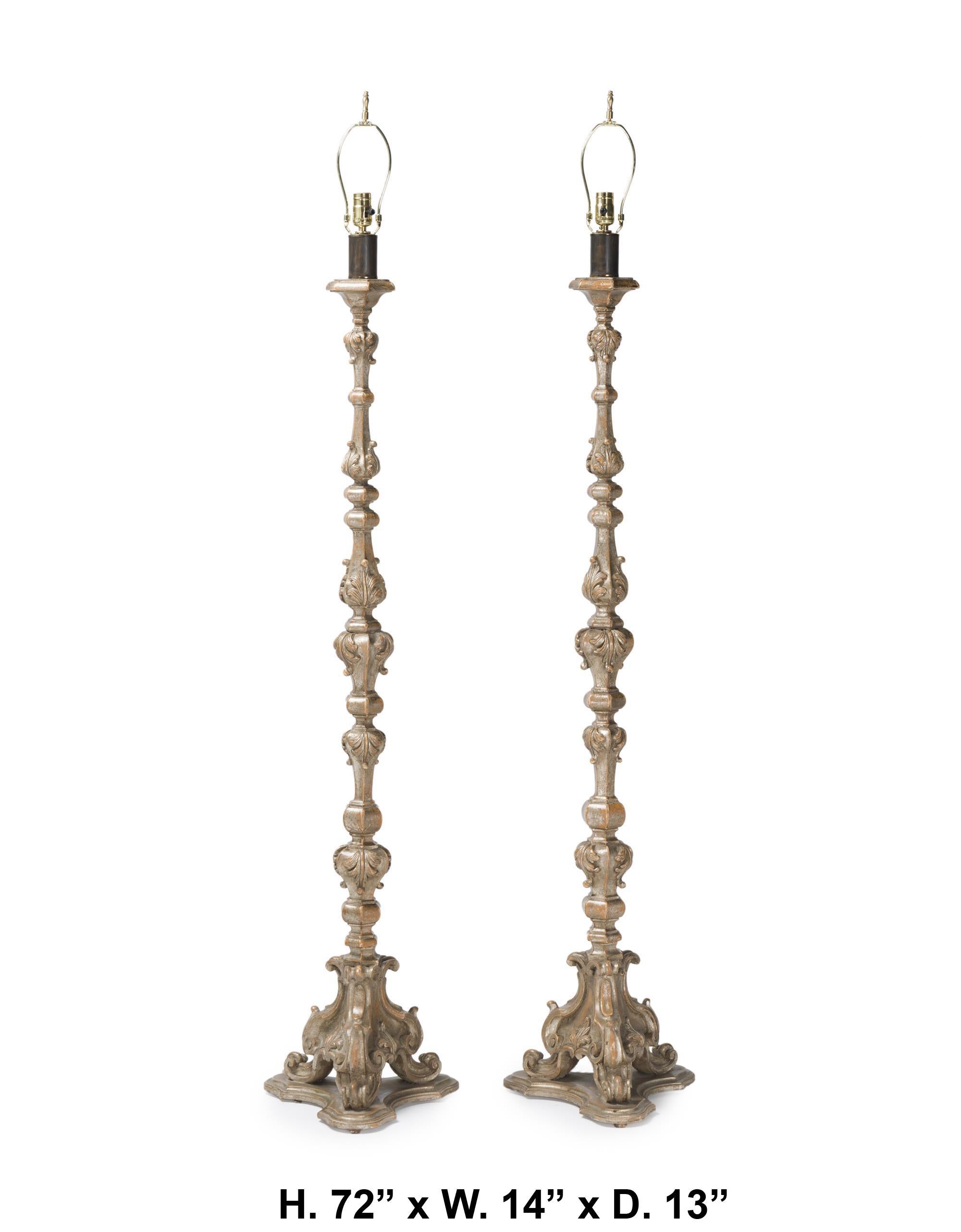 Lovely pair Italian Neoclassical style carved silver-leafed wood floor lamps
Third quarter 20th century 
shade are not included
Each: 72