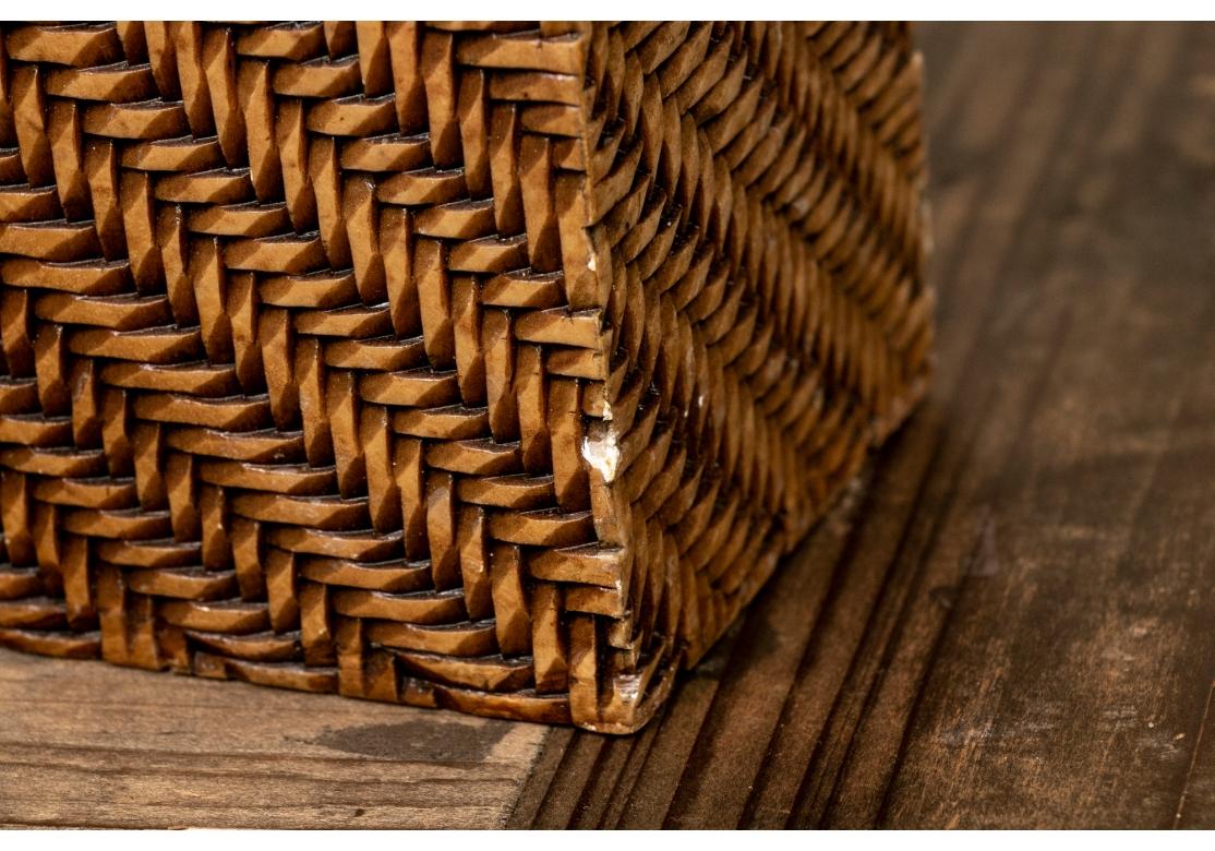 Intricately carved tan tone soapstone in a diagonal basketweave pattern overall. Square forms with carved overhanging rims. 
H. 11