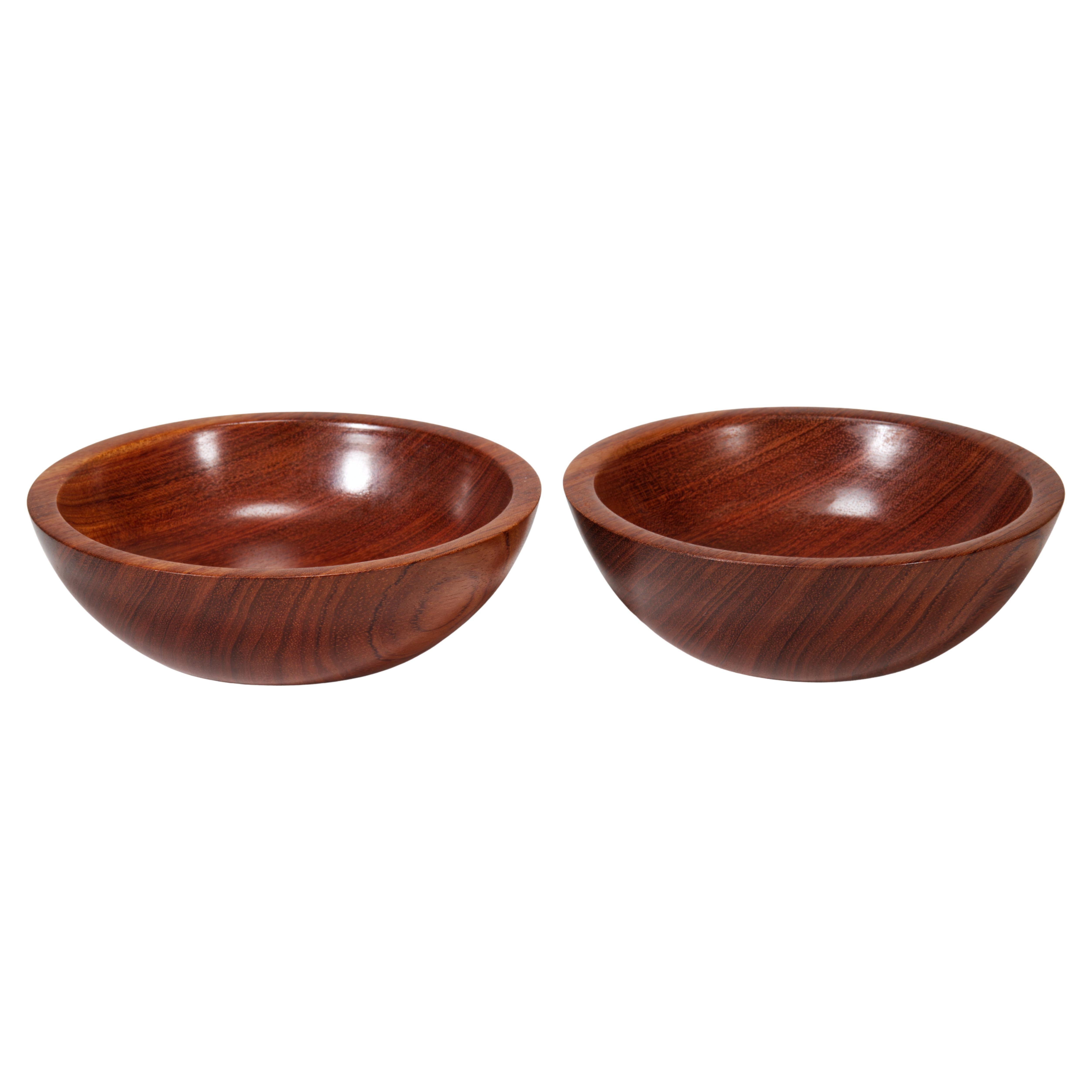  Pair of minimal, Organic Modern bowls feature rich natural grain of solid bubinga wood. The bowls are carved from 2 solid pieces of wood with similar grain placement, resulting in softly undulating darker and lighter stripes flowing from one side
