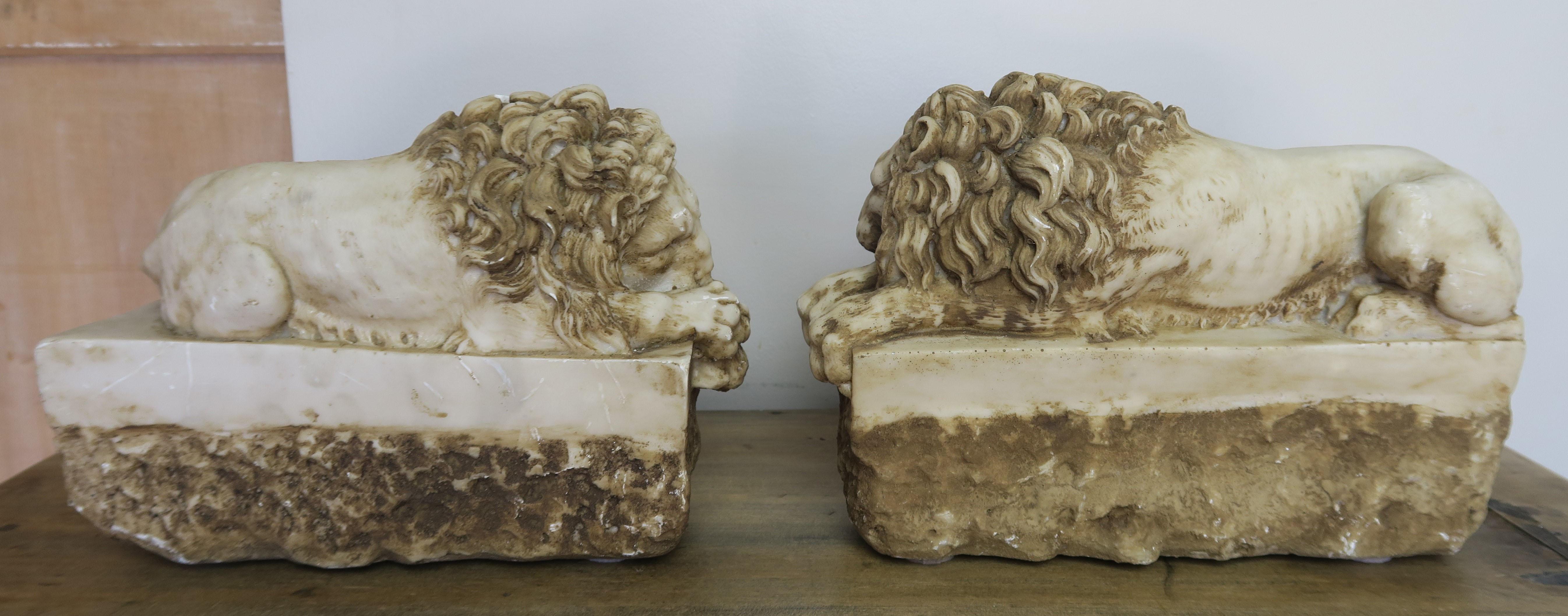 A pair of replica stone lions that were originally created by Antonio Canova (1757-1822). The renowned Italian artist, created the originals of these lions as a part of the monumental tomb for Clement XIII, in 1792 at St. Peter’s Basilica in Rome.