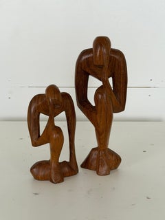 Coppia di sculture in teak intagliato raffiguranti “Il Pensatore”, stile Mid-Century Modern