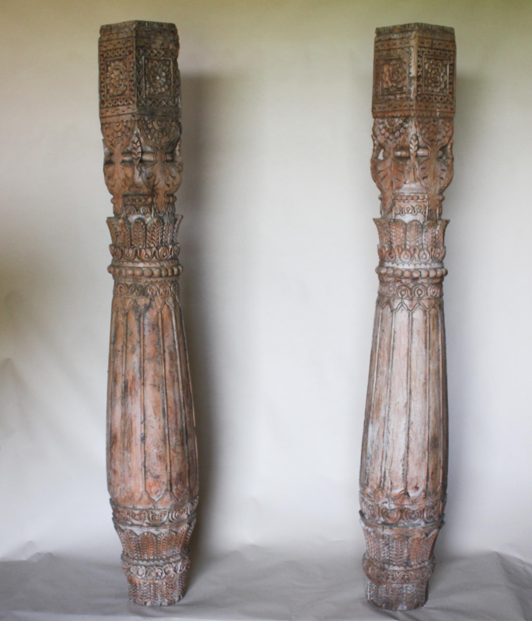 An exciting pair of hand carved teak wood pillars from Rajasthan, India. These late 19th century columns have an attractive form, wood tone and patina.
Measures: Height 76.50 inches, width (at belly) 12.50 inches, width (at top) 7.50 inches, width