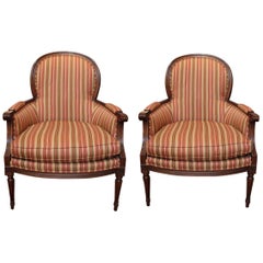 Pair of Carved Walnut Bergère Chairs