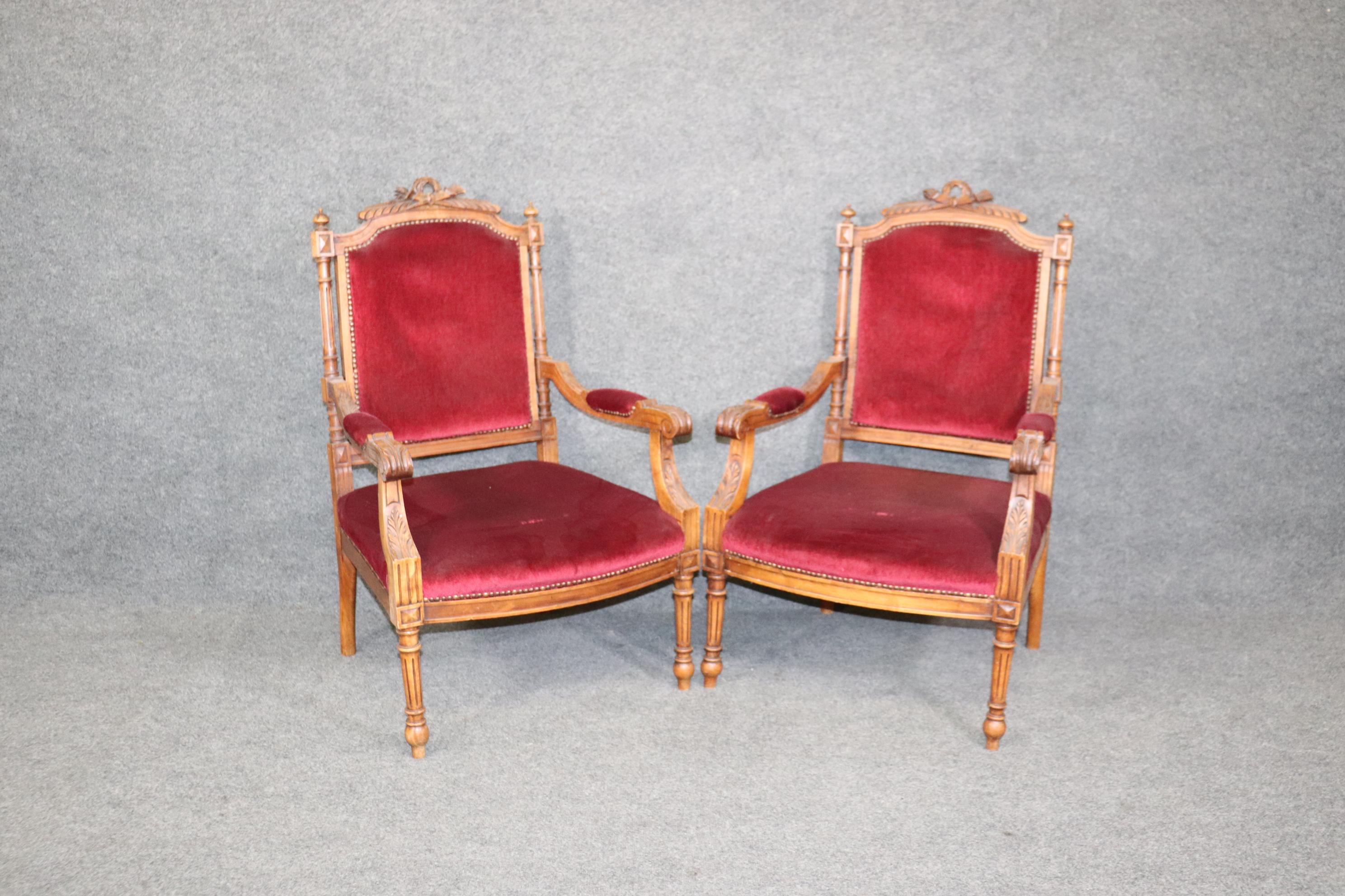 French Pair of Carved Walnut Burgundy Velvet Louis XVI Fauteuil Armchairs, circa 1920 For Sale