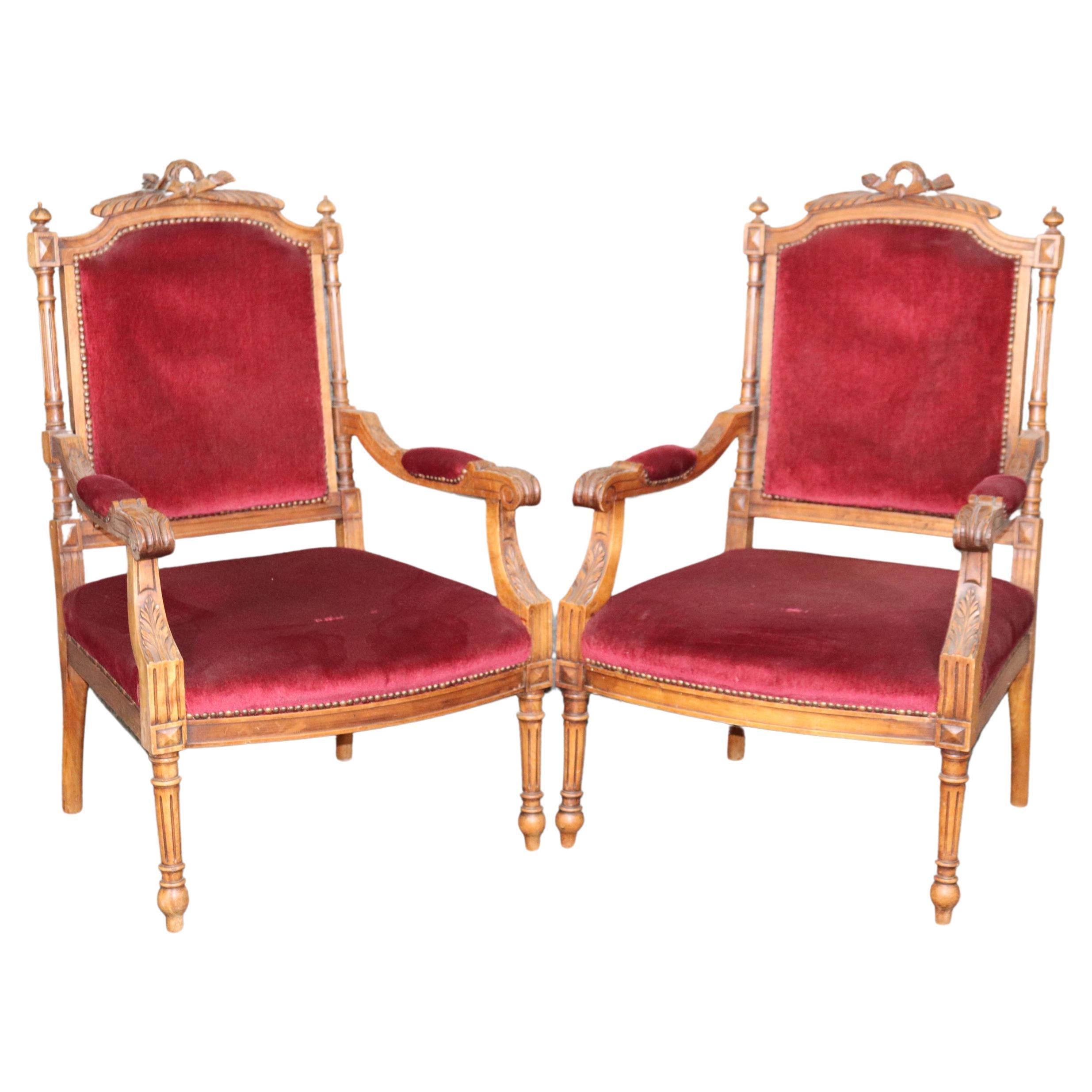 Pair of Carved Walnut Burgundy Velvet Louis XVI Fauteuil Armchairs, circa 1920 For Sale