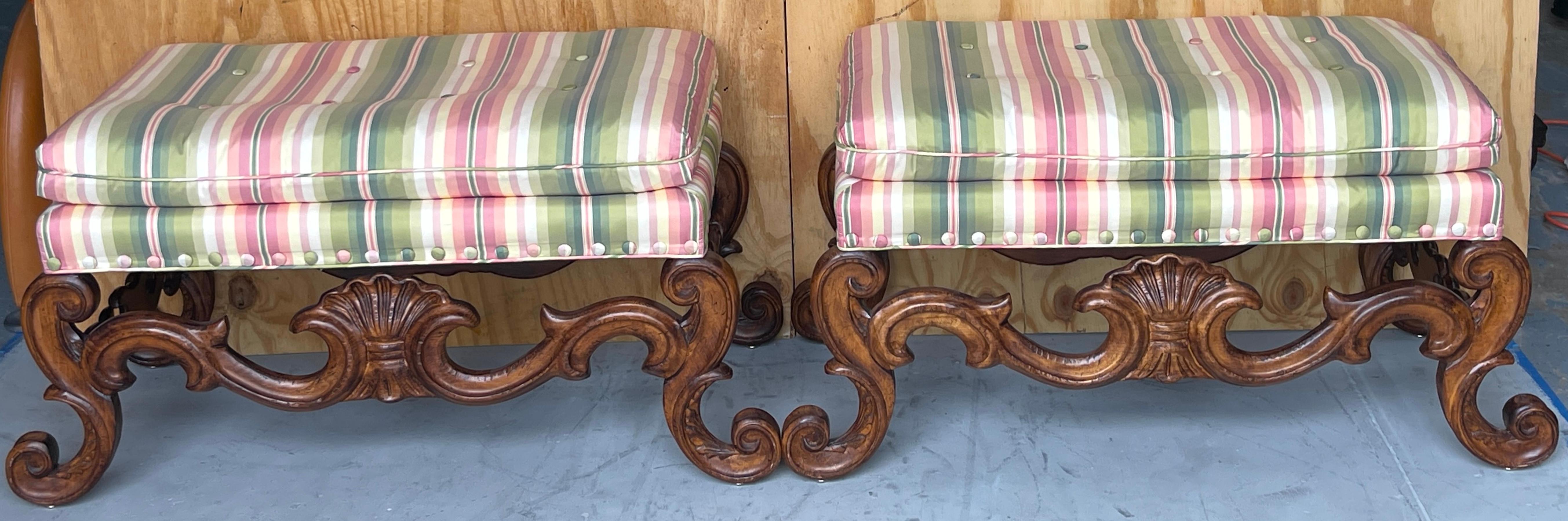 Pair of Carved Walnut Neoclassical Shell Carved Benches, By Baker 

A pair of graceful Carved Walnut Neoclassical Shell Benches made by Baker. These benches boast a substantial  presence, each featuring rectangular frames well carved from walnut in