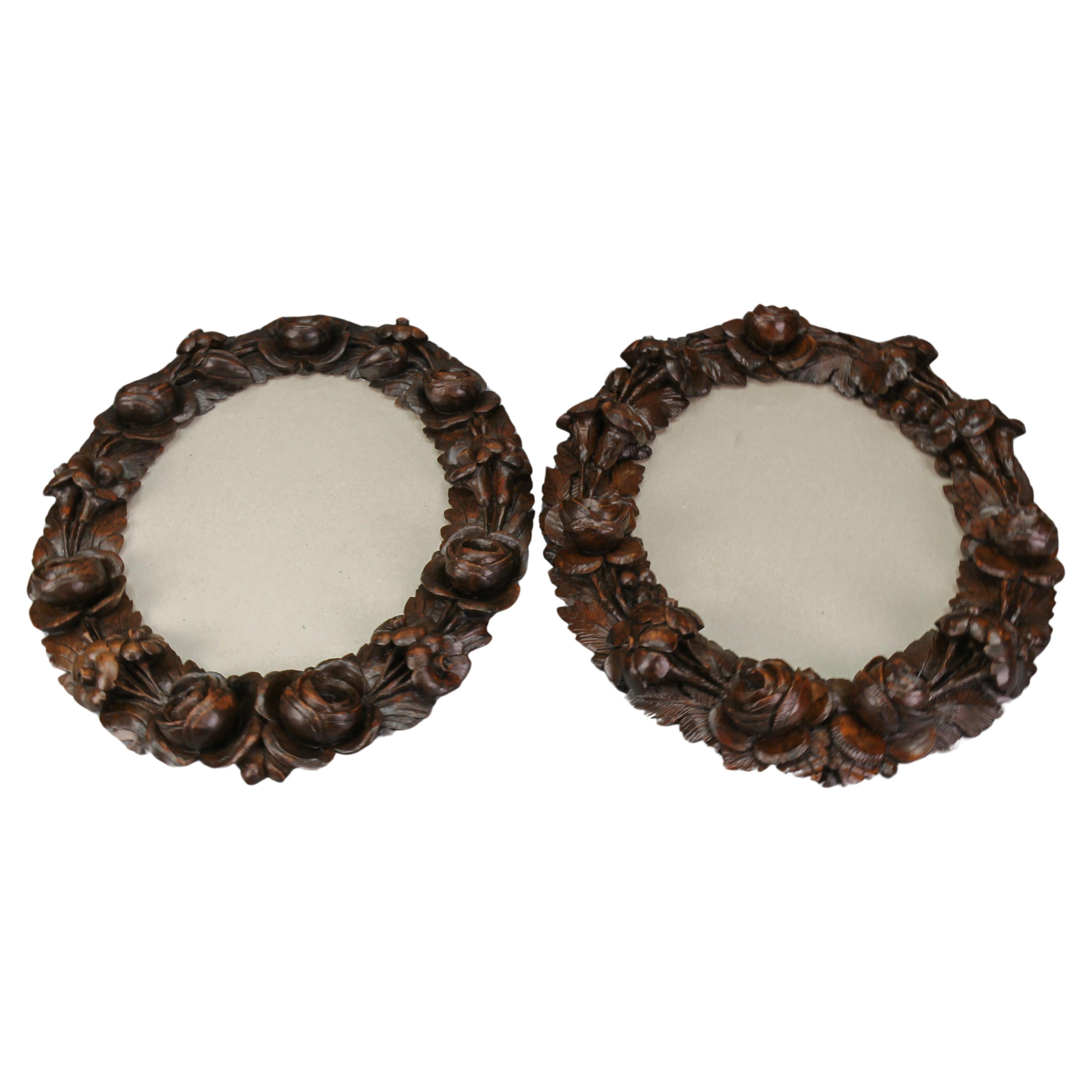 Pair of Carved Walnut Oval Dark Brown Wall Picture Frames with Flowers, ca. 1920