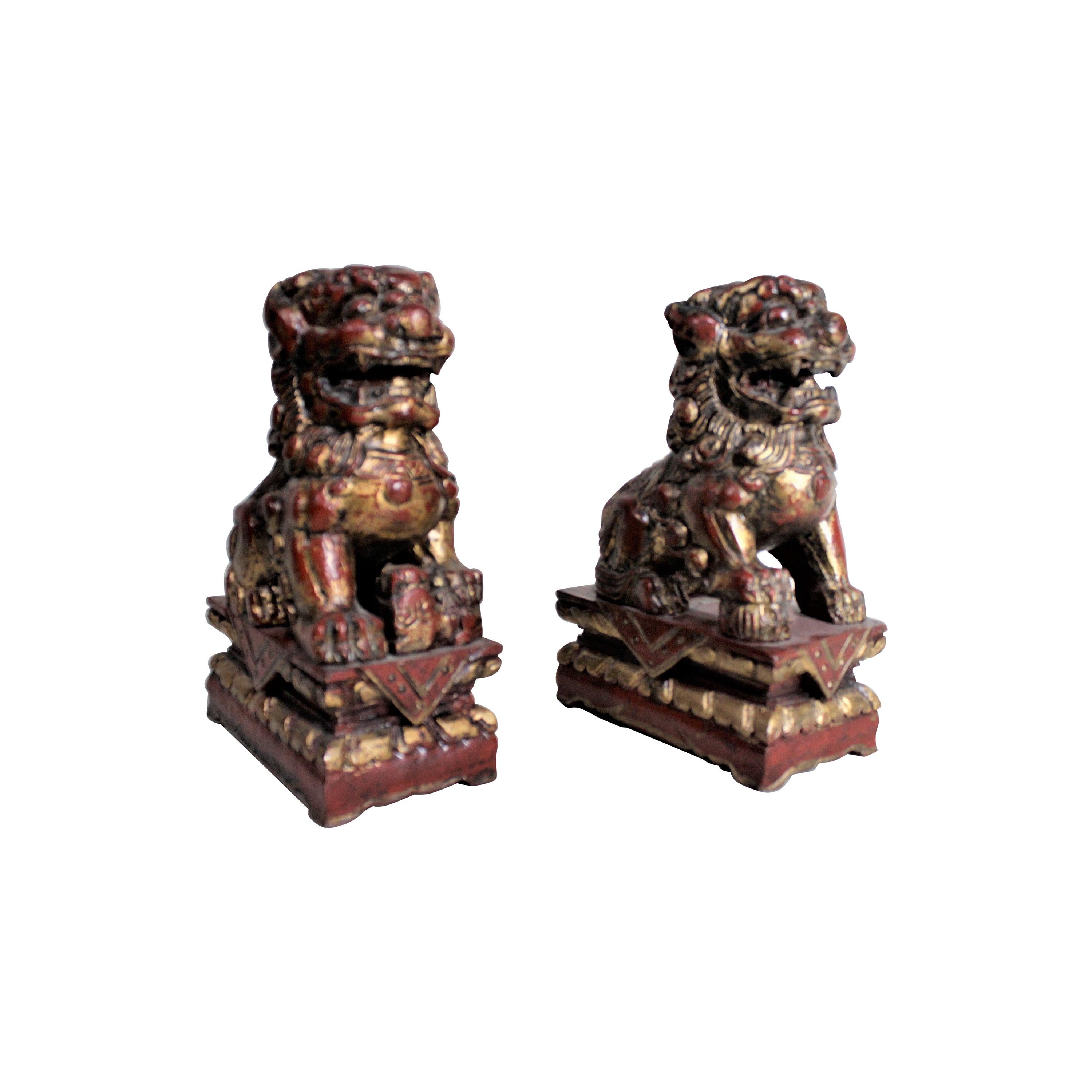 Pair of Carved Wood and Gilt Finished Chinese Foo Dog Figurines or Sculptures For Sale