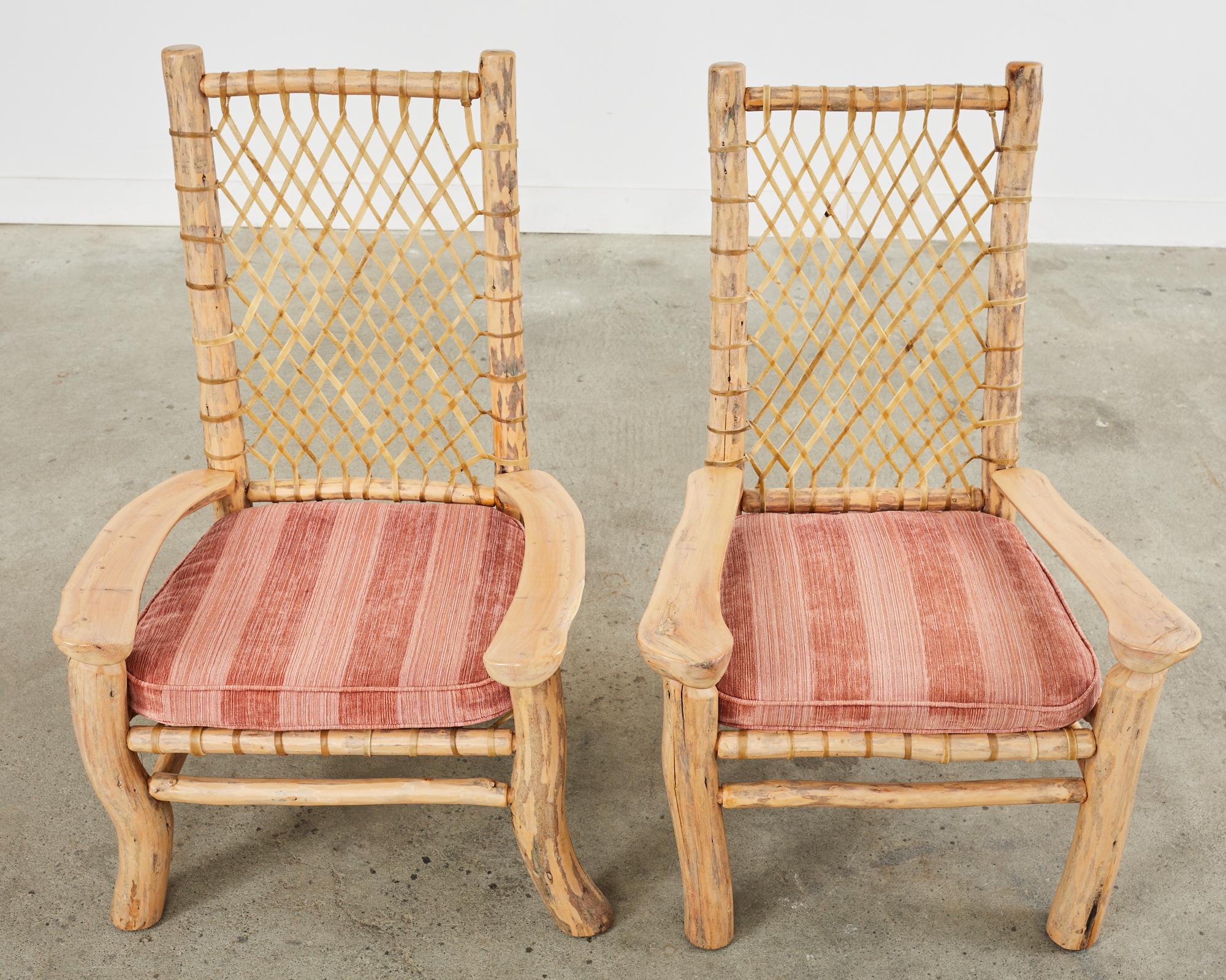 American Pair of Carved Wood and Rawhide High Back Adirondack Chairs 