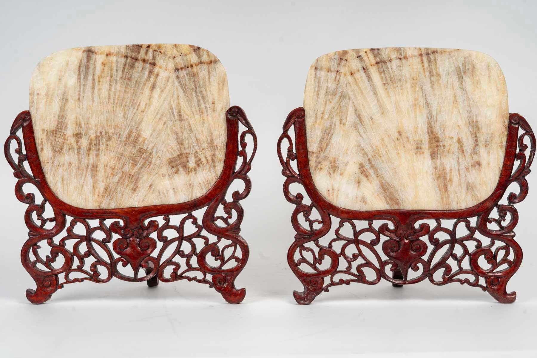 Pair of carved wood and transparent marble light covers, Art of Asia, 19th century.

A pair of carved wood and transparent marble lampshades, Art of Asia, 19th century or early 20th century.
h: 32cm, w: 29cm, d: 13cm