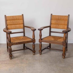 Paire de chaises en bois sculpté et tissé par Charles Dudouyt