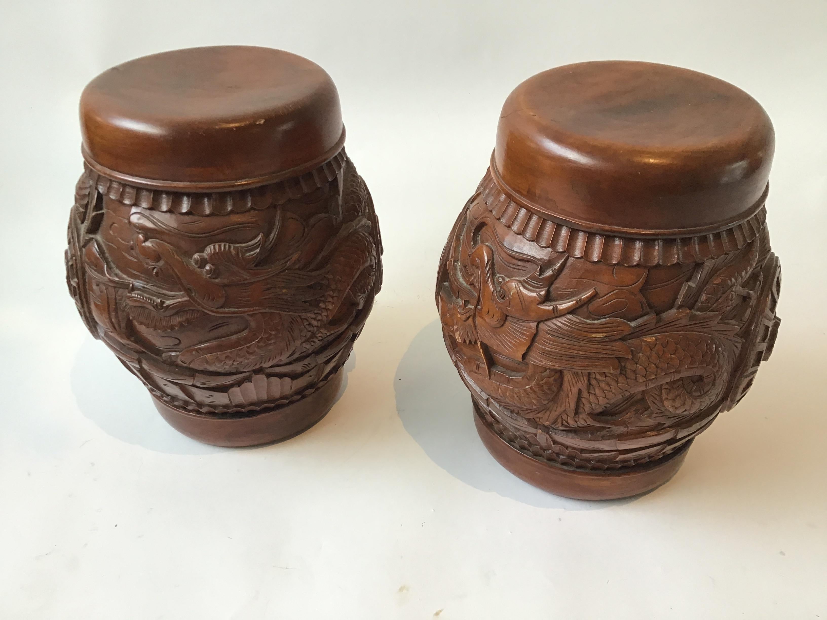 Pair of carved wood Asian dragon covered jars. From a Southampton, NY estate.